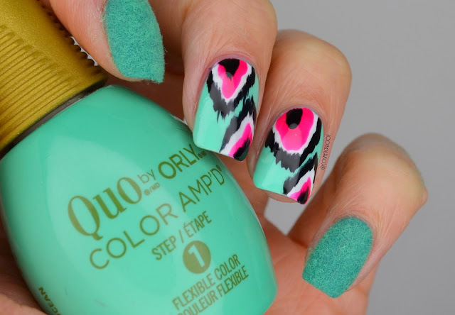 neon green ikat print nails holding nail polish bottle