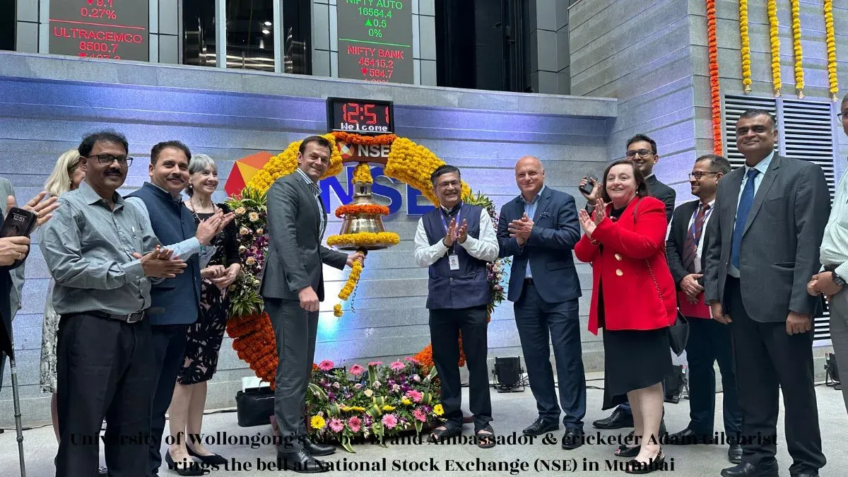 University of Wollongong's Global Brand Ambassador & cricketer Adam Gilchrist rings the bell at National Stock Exchange (NSE) in Mumbai