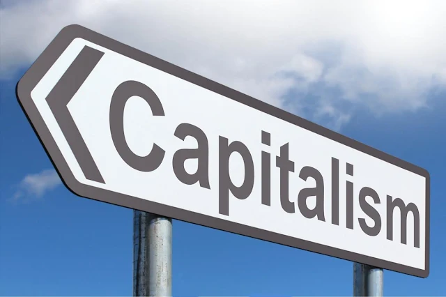 a board having word capitalism written on it