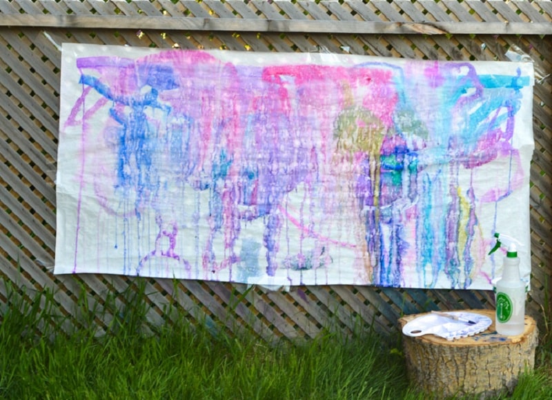 spray bottle painting on fence