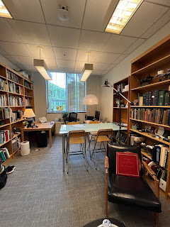 office flanked by bookshelves