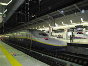 . we entered the bullet trains platform and found many duck bills trains . (japan shinkansen bullet train)