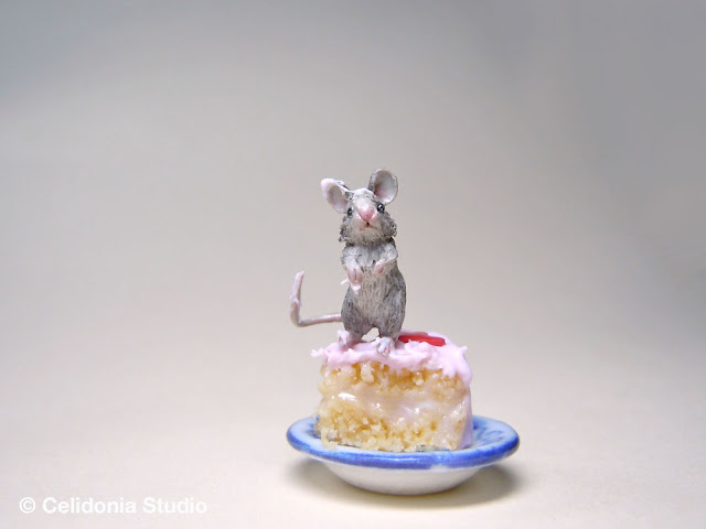 miniature mouse on cake