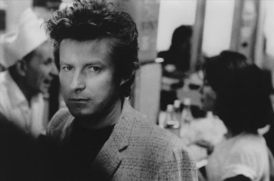 Don Henley black and white publicity photo headshot people in the background