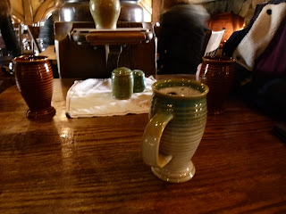 A mug of cider on a table