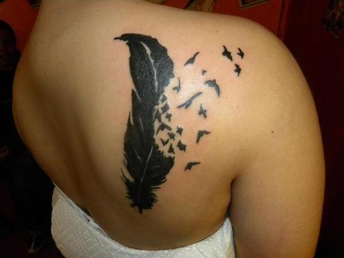 Tribal Feather tattoo I absolutely love this design and how the feather 