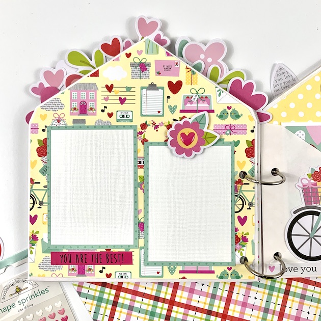 Valentine's Day Envelope Scrapbook Album with flowers, music notes, a bike, house, and birds