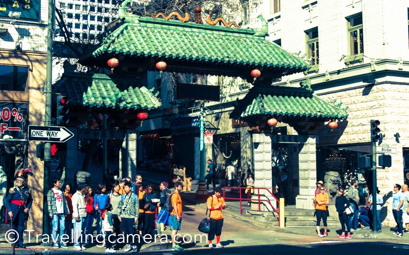 During recent official trip to San Francisco, I was staying around Union Square and planned to walked till China Town. Before reaching the town, I had read a lot about China Town on internet and planned to check out some stuff in these markets. This post shares some photographs from streets around China town, it's shop and our experiences. We were staying in Hilton hotel and China town is just 10 minutes walk from the hotel. We picked a map from the reception and headed towards China Town. After walking for few minutes you see above gate, which indicates the entry to China Town of San Francisco. This market is quite popular for buying electronic stuff and cheap stuff. The colorful shops of China town have variety of stuff. They have always some lucrative deals posted outside, which would make you decide to have a look. After crossing these huge buildings of Union Square you suddenly reach streets with 4 storey buildings and most of them are either shops or restaurants. There are some interesting eating places in the market, but mainly for folks who eat non-veg.As we were walking in these streets, we noticed varied performances happening. There were some very talented folks on the street, who were singing, playing music or doing some acts. I was super impressed by this man who was playing drum with empty containers & bottles of different size, shape and material. That was pretty interesting. Later I realized that lot of folks in San Francisco were doing it. Seemed like a common practice on streets.There are few churches around Chinatown in San Francisco. We didn't go inside these churches except the one which had huge lawn in front of it. This church was located just next to the China Town - Saints Peter and Paul Church. China town offers some great deals on these souvenirs. If you plan to buy the same stuff at Union Square or other places, you will find it costly. But condition is that you need to buy in larger quantity. Larger means 4+ for these souvenirs.This man was sitting still without any movement and for a moment we though that it's a statue installed here. This was our first sight and then we again noticed such things in various parts of the city. btw, we didn't buy anything from Chinatown and then realized that suvnirs could have been bought from there. Later I bought the same stuff at Union Square at 50% times more cost. I am not sure if I should recommend this place for all the travellers visiting San Francisco, but it can be an interesting experience to see such place adjacent to Union Square which has huge contrast.