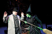 Clive Carter as The Wizard of Oz (seen here with Rachel Tucker just before .