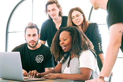 people working with a laptop