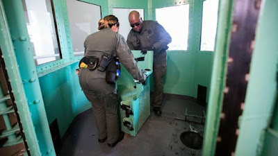 A chair is removed from the gas chamber at San Quentin State Prison, California.