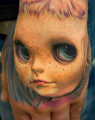 tattoos freckled girl with huge eyes