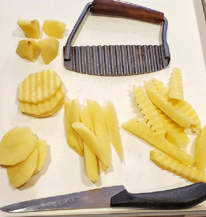 these are raw potatoes cut into all different shapes to make salt and vinegar french fries, waffle fries and all kinds of shaped potatoes