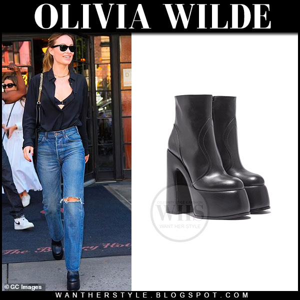 Olivia Wilde in black shirt, jeans and black platform boots