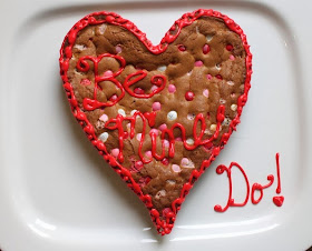 Food Lust People Love: Bake a Big Be Mine Heart Cookie for your sweetheart. A big M&M cookie cake baked in a heart pan and decorated with red sugar icing:  Be Mine!