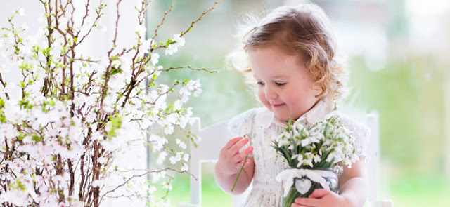  Girl looks at flowers