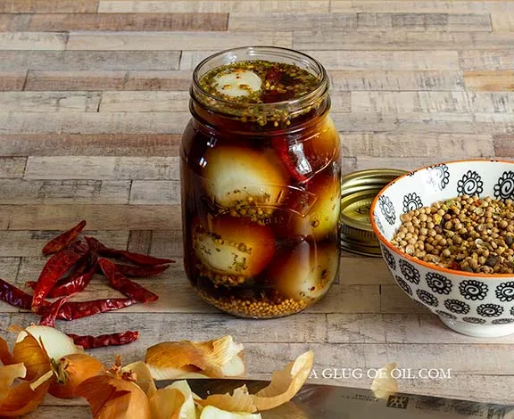 Pickled onions in a Kilner jar.