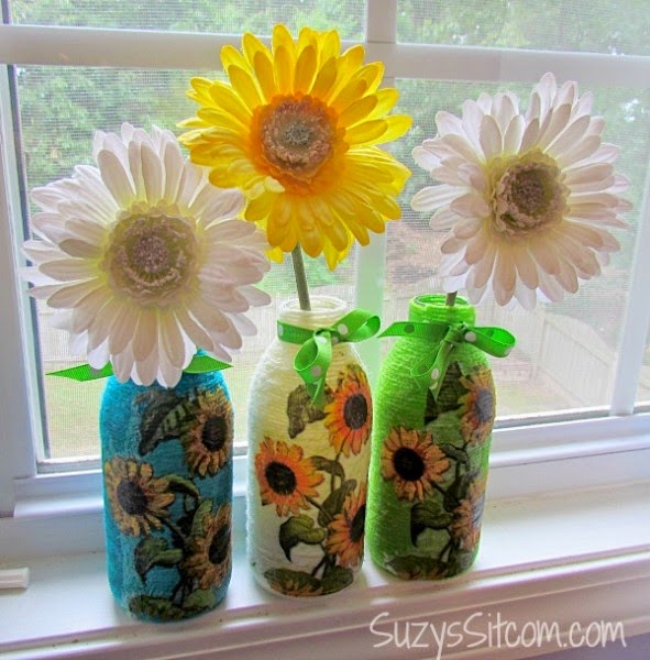 http://suzyssitcom.com/2014/05/great-recycled-craft-yarn-wrapped-bottles-with-decoupage.html