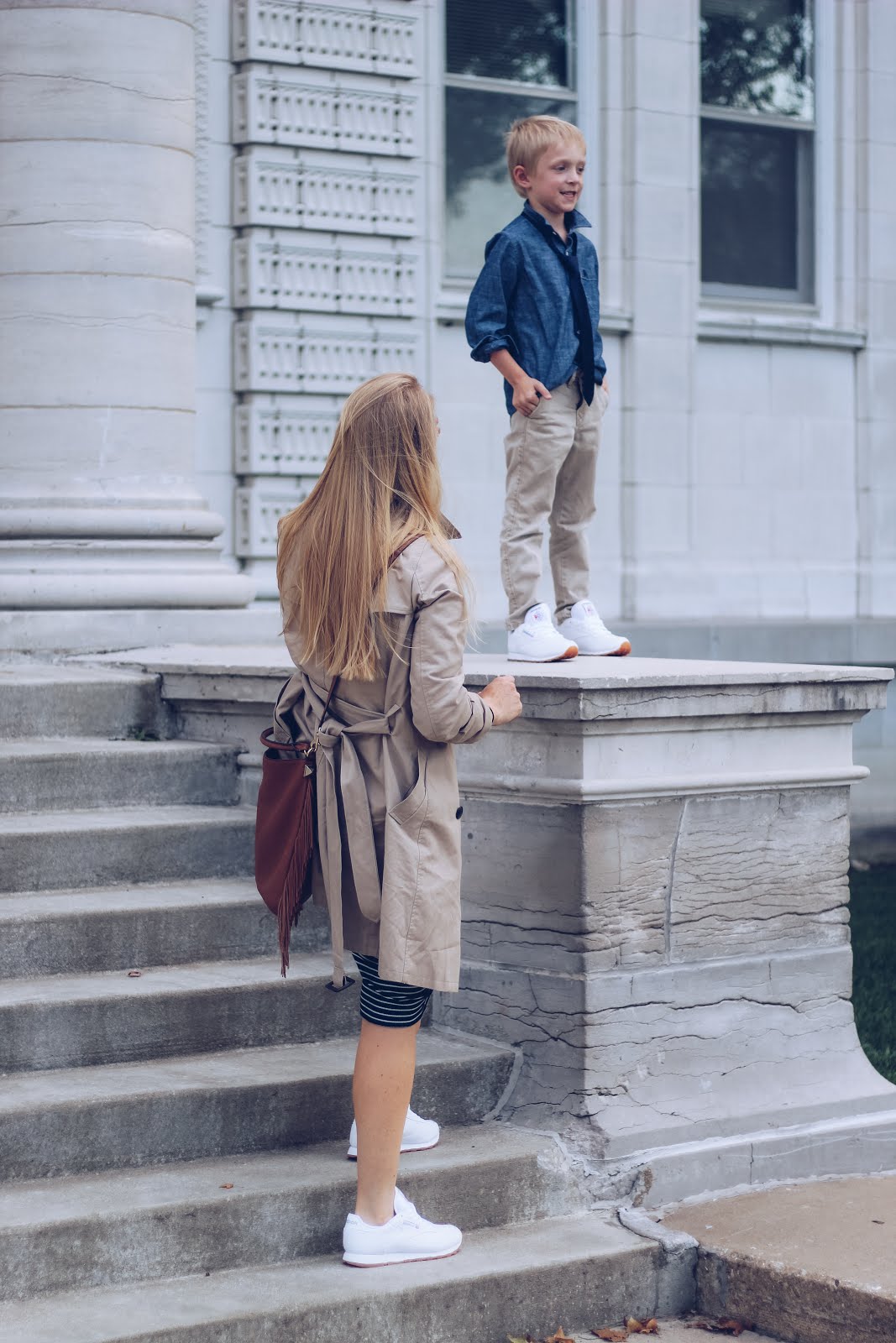 white reebok classics. mom outfit. mother son outfits. fall outfit with tennis shoes. trench coat outfit.