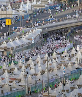 Muslim pilgrims walk back to their tents during the annual Haj pilgrimage on the first day of Eid al-Adha in Mina, outside the holy city of Mecca, Saudi Arabia.