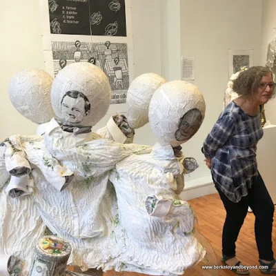 artist Sue Cavanaugh beside her work at (Not) Sheep Art Gallery in Columbus, Ohio