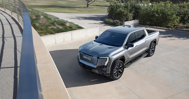 2024 GMC Sierra EV Denali Edition 1 - front, left side, and top view.