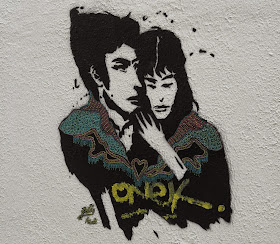 Paris street art graffiti Spanish couple