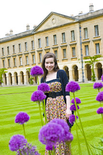 Anna Popplewell with purple flowers