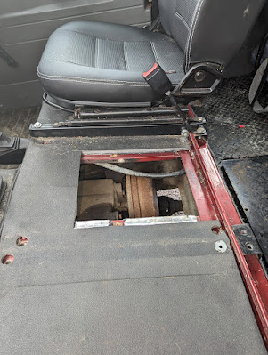 Defender middle seat access plate removed