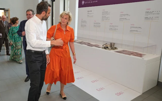 Princess Astrid wore a new orange belted midi dress by Marie Mero. Chanel two tone flats. King Albert I and Queen Elisabeth