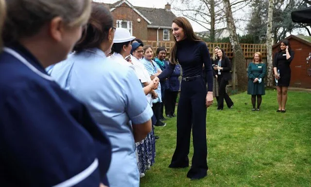 Princess of Wales wore a camel coat by Max & Co. Emmy London navy block heel pumps. Polene Paris navy bag