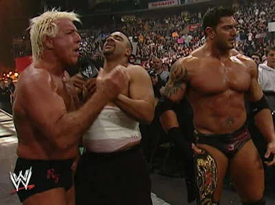 WWE Royal Rumble 2004 - Jonathan Coachman celebrates with Batista and Ric Flair