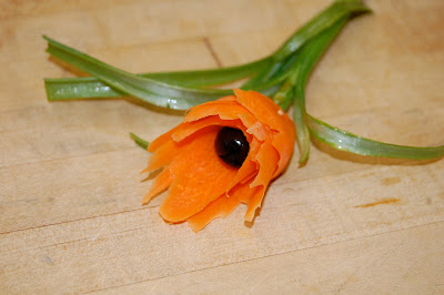 Carrot Flower With Olive Center and Green Onion Stem and Leaves