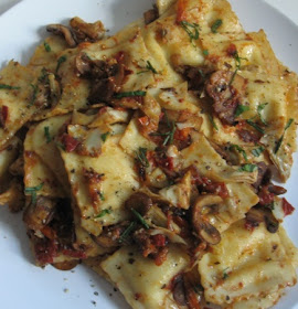 Ravioli with tomatoes, mushrooms, and artichoke hearts