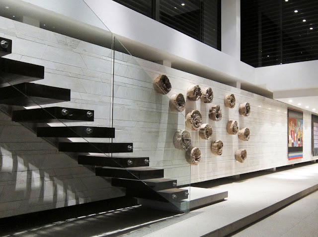 Picture of concrete staircase with glassy railing in the hallway