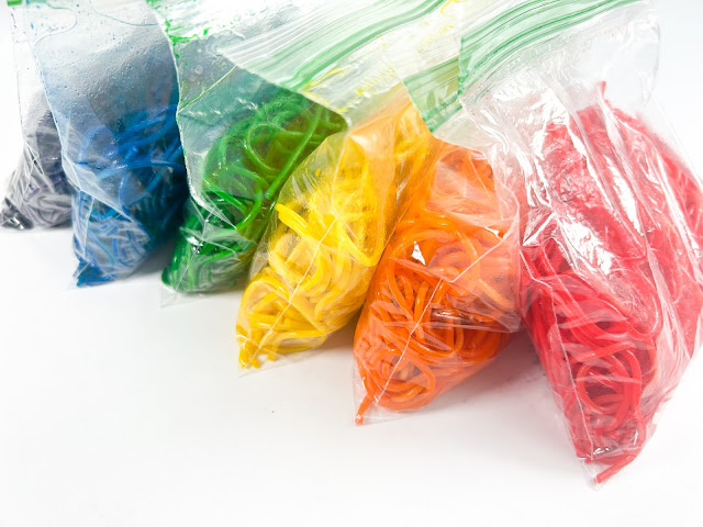 rainbow spaghetti in ziploc bags.