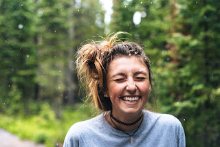 woman smiling in a forest