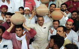 कानपुर : पेयजल संकट को लेकर सपा विधायक ने जलकल मुख्यालय पर सिर पर मटका रख किया प्रदर्शन 