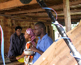 Christmas in Kampala (2010):  Patrick Mukasa, Shiraz Nargis and Emma Ssebakigye and Matayo in Joseph's Carpentry Workshop