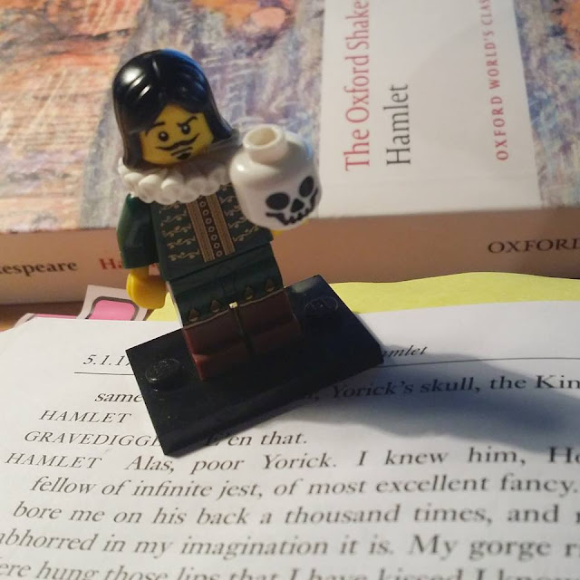 LEGO Hamlet standing on books