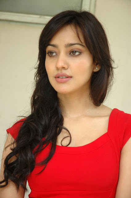Neha Sharma looking sexy in red dress