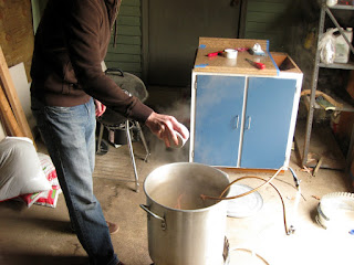 Luke adding the last dose of hops to the Styrian Bitter.