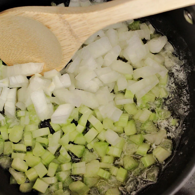 celery and onions for pork chops and stuffing bake in pan cooking with butter