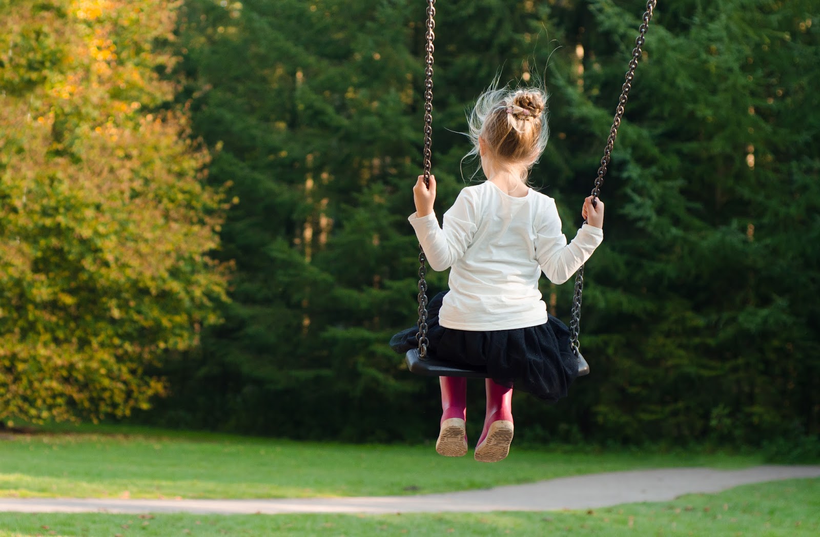 Montessori Today Chapter 7 Freedom Responsibility Going Out. girl on swing