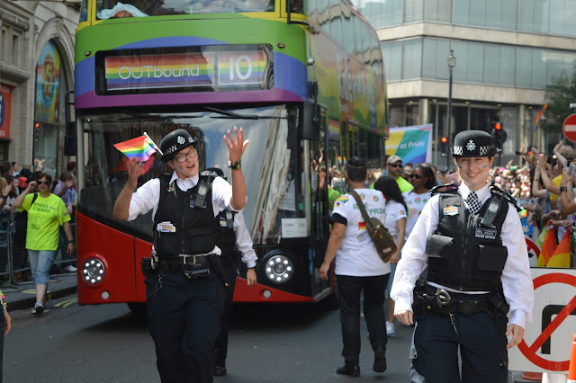 London bus and police at London Gay Pride 2015