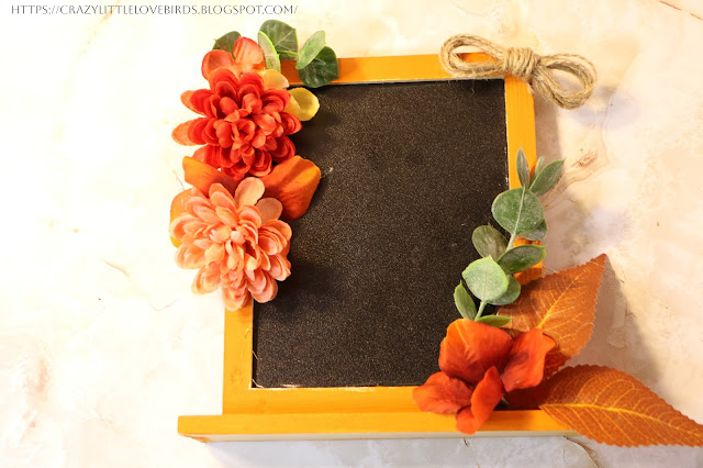 Painted framed chalkboard with faux floral, and twine