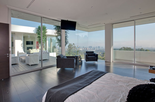 Bedroom with tv on the ceiling 