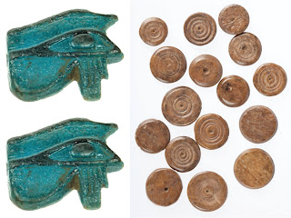 Two Ancient Egyptian eye brooches and a series of Ancient Roman game counters