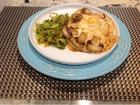 sprialized zucchini and mushrooms with a fried egg