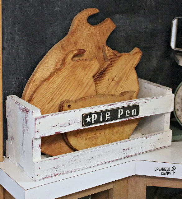 Thrift Shop Pig Cutting Boards in a Pen www.organizedclutter.net